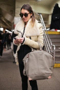 Trendy Commuter sporting a leather jacket and an Alexander Wang purse