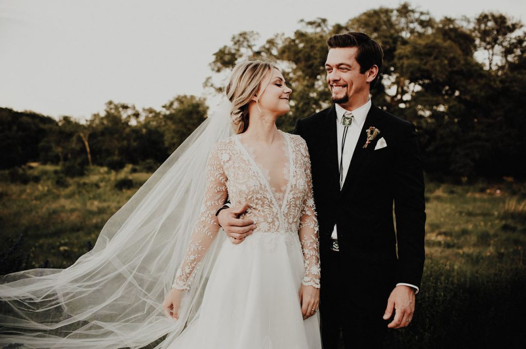 Another shot of the same woman, this time with a groom in a black suit