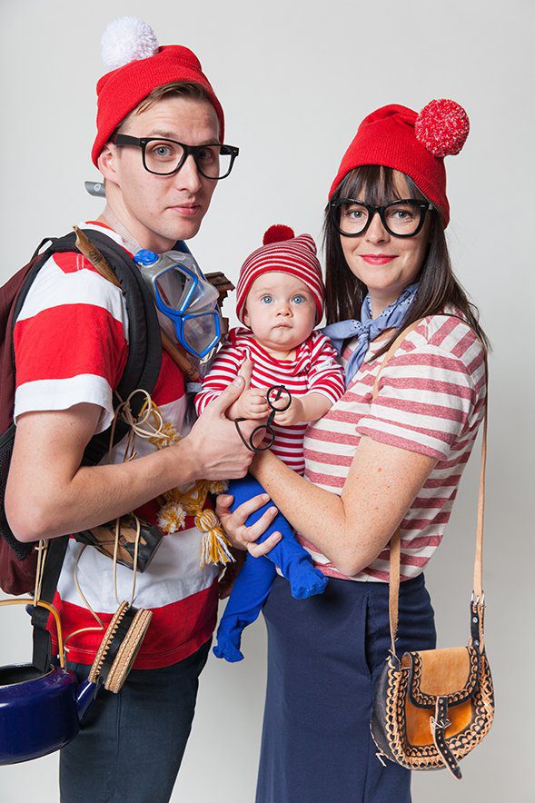 Family dressed in red and white striped shirts and toques as Where's Waldo