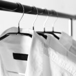 Clean white dress shirts hanging up