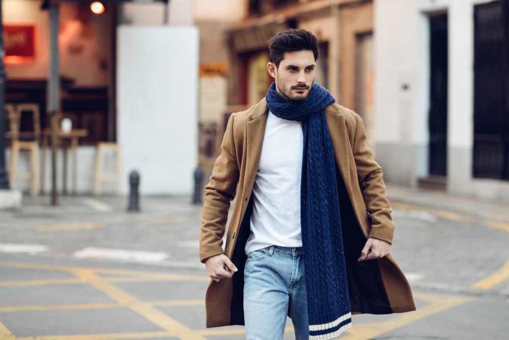 Fashionable man wearing a long scarf