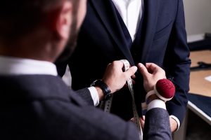 Over,Shoulder,View,Of,Bearded,Fashion,Designer,Fitting,Bespoke,Suit