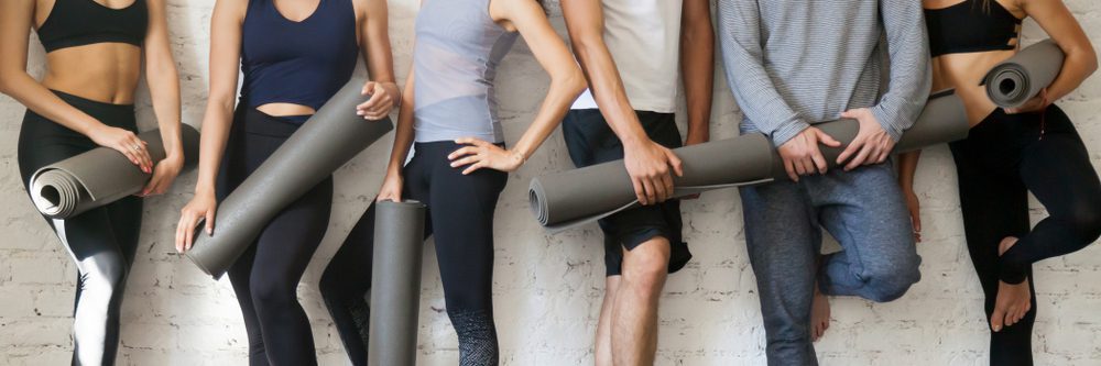 Horizontal,Photo,Group,Young,Sporty,People,Wearing,Activewear,Holding,Yoga