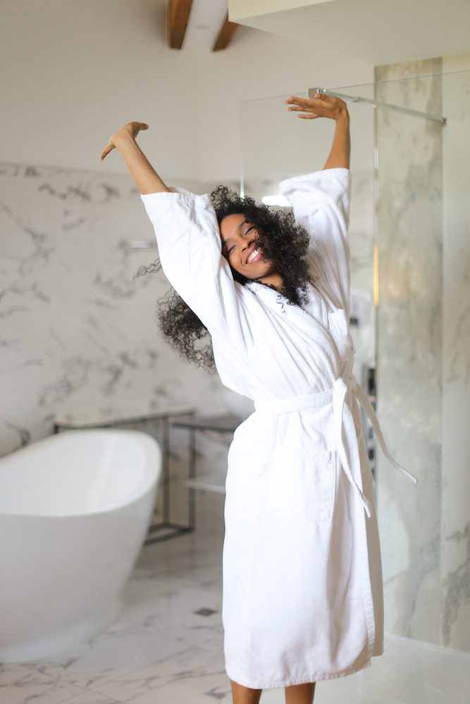 woman, in, bathrobe, in, bathroom